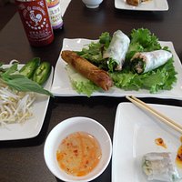Chargrilled Chicken Spring Rolls and the Vetinamese Deep Fried Egg roll . The condiments for the pho noodle bowl is with fresh bean sprouts, basil leaves, hot jalapeno peppers and wedges of lime and a light dipping sauce. Yummy !