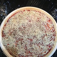I can almost see more red than white. Not enough cheese for a pizza that's supposed to be a 3 cheese pizza.