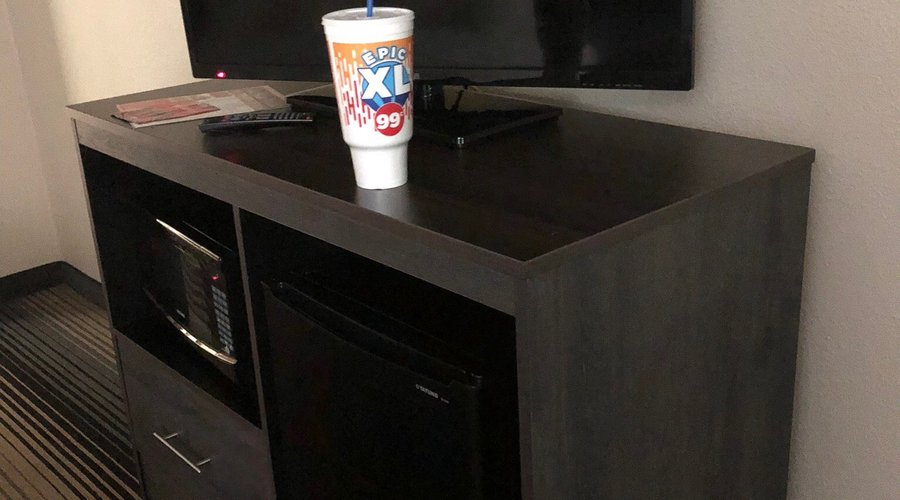 Random Big Gulp we found in our room that was not ours! Bed before we sat on it vs bed after that sunk down and slanted. Hole in the wall that we were hoping wasn’t from a bullet!?