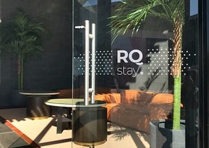 RQ Antofagasta in Antofagasta, image may contain: Potted Plant, Indoors, Door, Couch