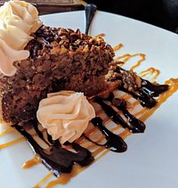Pecan Pie with chocolate and caramel drizzle.