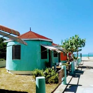 4 quirky Mini Chalets steps from the beach.....