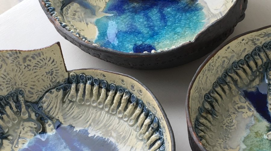 Textured vessels with recycled bottle glass