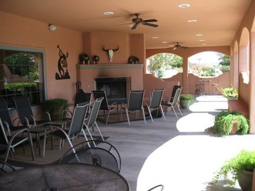 Covered patio with fireplace.