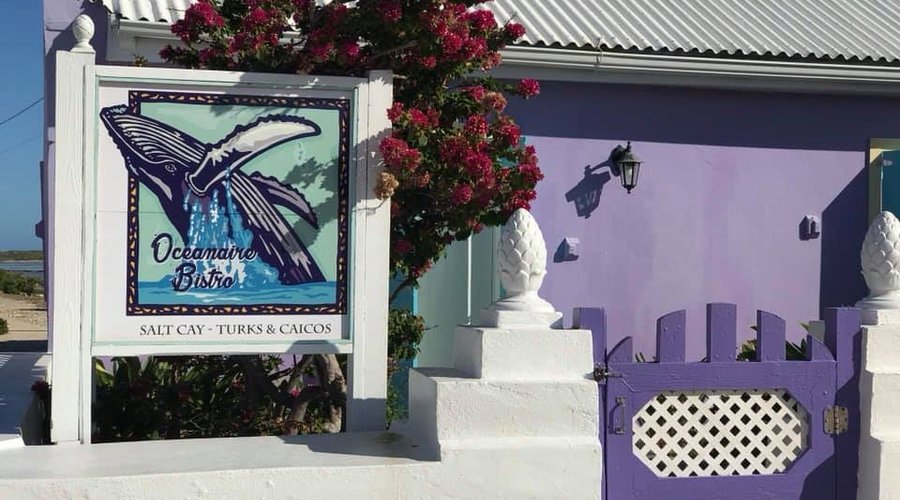 A few steps from the Harbor, we welcome you for breakfast, lunch and dinner... or just stop by and have an island drink with friends.
