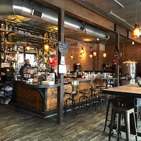 Industrial-European interior. Next door brew-pub, San Luis Valley Brewing Company, has same owners and the vessels in the photo are used to expand output of craft beers.