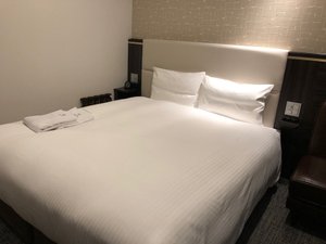 Via Inn Nagoya Ekimae Tsubakicho in Nagoya, image may contain: Furniture, Bed, Bedroom, Room