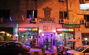 Amman Pasha Hotel in Amman, image may contain: Lighting, Pub, Purple, Bar Counter