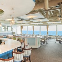 Spectacular. The Ocean View and The Menu. Feel the waves break gently beneath your feet as you enjoy fresh fish, seafood and steaks in a contemporary, casual atmosphere. The award-winning Seaglass Restaurant offers seasonal, sea- and farm-to-table American cuisine expertly prepared with a creative spin by Executive Chef Harley Smith. A rejuvenating dining experience, Seaglass is ideal for intimate get-togethers or group gathering. A lively bar boasts trendy cocktails and an extensive wine list.