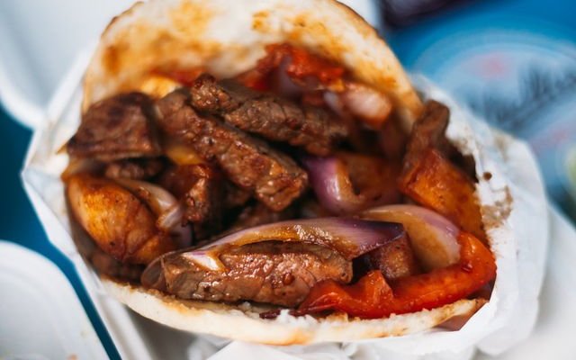 Lomo arepa: Sauteed steak, red onions, tomatoes, yuca bites 