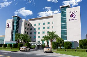 Premier Inn Dubai Investments Park in Dubai, image may contain: Office Building, City, Hotel, Car