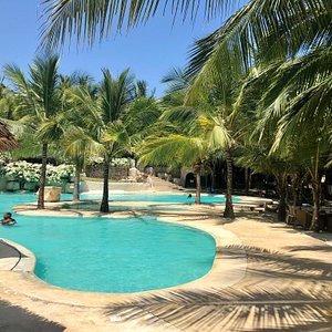 Swahili Beach in Diani Beach, image may contain: Hotel, Resort, Summer, Pool