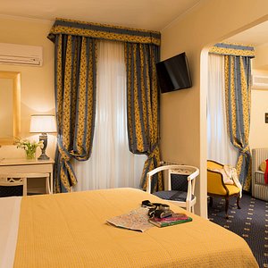 Hotel Napoleon in Rome, image may contain: Furniture, Book, Bedroom, Bed