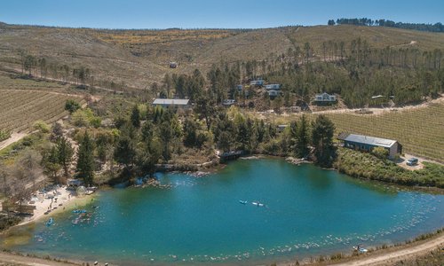 Birds eye view of our lake, beach and trailers on the hillside