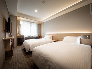 Nishitetsu Hotel Croom Nagoya in Naka, image may contain: Dorm Room, Bed, Furniture, Bedroom