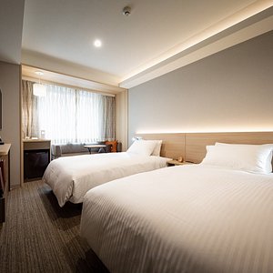 Nishitetsu Hotel Croom Nagoya in Naka, image may contain: Dorm Room, Bed, Furniture, Bedroom