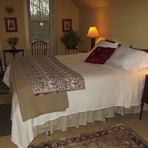 Queen sized bed at Royalton Bed and Breakfast with views of the garden, fields and forest.