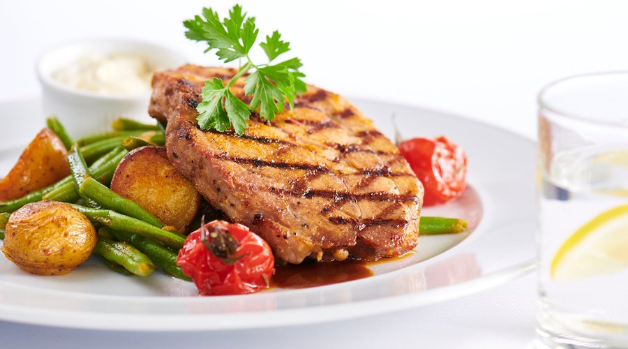 Grilled pork with green beans, roasted Grennailles  & garlic mayonnaise