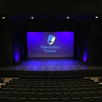 The auditorium and stage of the Newmarket Theatre as seen from the back row.