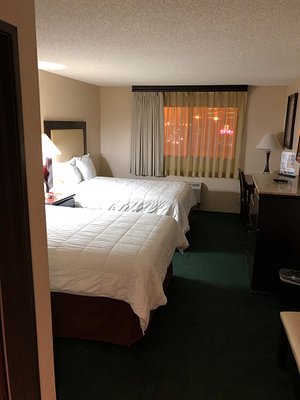 Longhorn Casino & Hotel in Las Vegas, image may contain: Dorm Room, Bed, Furniture, Lamp