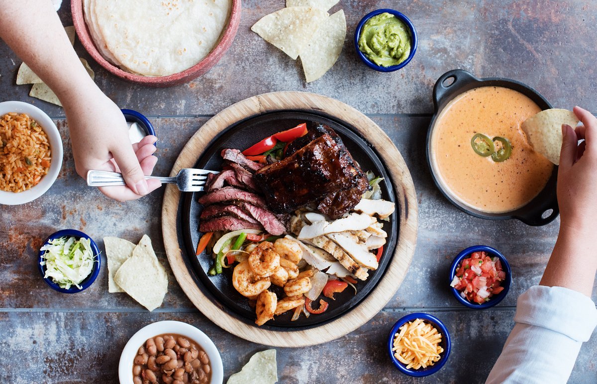 https://dynamic-media-cdn.tripadvisor.com/media/photo-o/16/9b/68/f6/fajita-fiesta-with-an.jpg?w=1200&h=-1&s=1