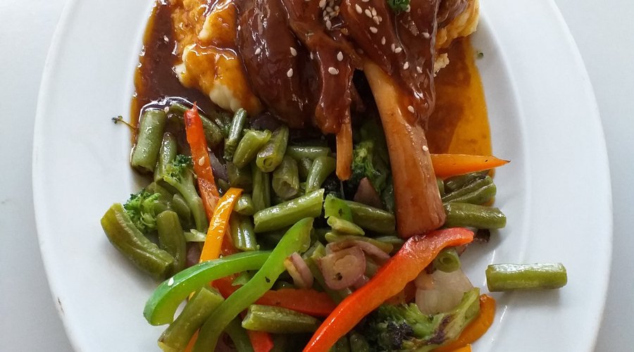 Delicious Lamb Shank on Mash with sauteed Greens