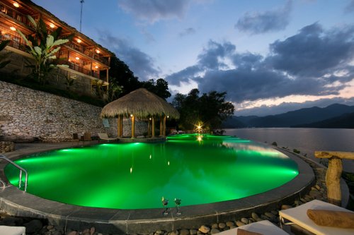 Enjoy our Infinity pool
AN EXTRAORDINARY WORLD! Perfectly positioned in the heart of the magnificent Hoa Binh Lake you’ll find our infinity pool with breathtaking panoramic views. The hideaway pool is the heart of the resort. Loved by sports fans, vacation experts & spa aficionados who wish to indulge in this exclusive atmosphere.
SIT BACK & RELAX: admire the dancing sun reflation of the stunning blue water of the lake while reading a book or just forget your everyday stress and recharge.
