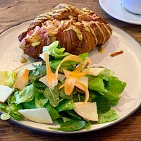 Ham and cheese croissant with salad