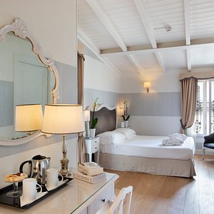 Hotel Rapallo in Florence, image may contain: Interior Design, Furniture, Bedroom, Home Decor