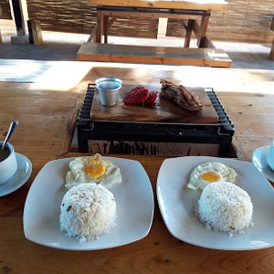 Hamonado longganisa and daing na bangus with fried egg and free-flowing coffee and sweetened tablea for breakfast