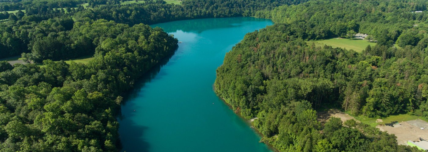 Green Lakes State Park's outstanding features are its two glacial lakes surrounded by upland forest. Both Round and Green Lakes are meromictic lakes, which means that there is no fall and spring mixing of surface and bottom waters. Such lakes have a high potential for evidence of ancient plant and animal life.