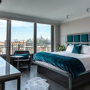 Hotel Le Bleu in Brooklyn, image may contain: Penthouse, Building, Balcony, Bed