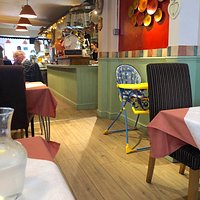 Tables are well set apart in this long room