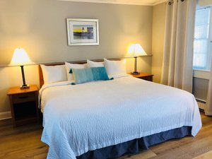 Hyannis Inn in Hyannis, image may contain: Lamp, Bed, Furniture, Table Lamp