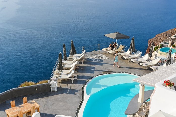 Ultimate Greek Island Getaway: Discover the Top 11 Cave Hotels in Santorini with Swim-Up Pool Views (2024) - Andronis Boutique Hotel swim-up pool views and elegant cave suites