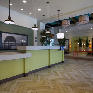 Hampton Inn Suites San Juan in Puerto Rico, image may contain: Hotel, Resort, Chair, Dining Table