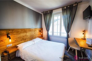 Hotel Victor Hugo in Lorient, image may contain: Interior Design, Bedroom, Bed, Furniture
