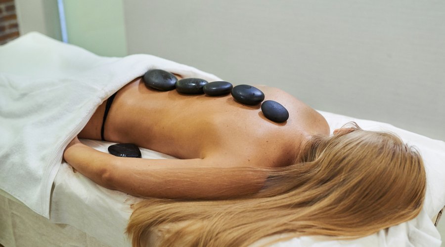 Hot stone massage in our massage room