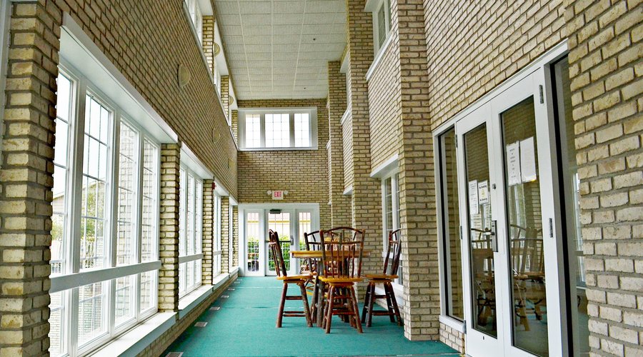 Lovely sun porch directly off of our indoor pool area.