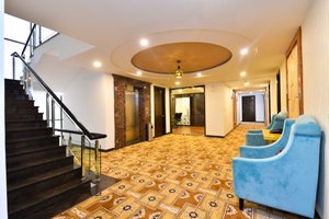 Hotel Sun City Plaza in Jaipur, image may contain: Staircase, Floor, Flooring, Living Room