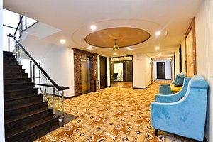Hotel Sun City Plaza in Jaipur, image may contain: Staircase, Floor, Flooring, Living Room