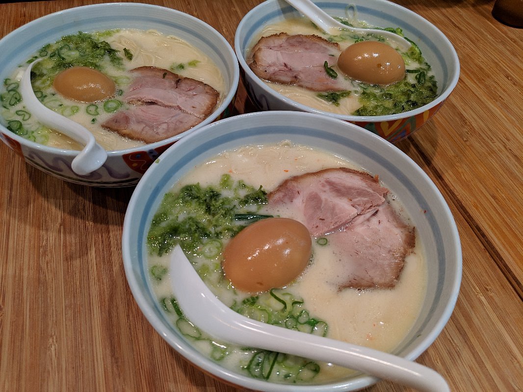 A close-up photo of a steaming bowl of ramen from Maruhachi Ramen in Vancouver, Canada. The ramen features noodles, broth, slices of meat (like chashu pork), a soft-boiled egg, and other toppings. (Photo by James C. on Tripadvisor)