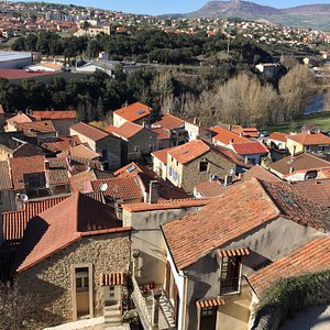 This is the view from room 25, looking out over the roofs of the hamlet of Creisell. then to Millau and finally to les Grands Causses. The River Tarn flows between Creissels and Millau and can be seen to the right between the trees.