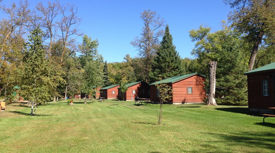 Cabins along lakefront and beach.