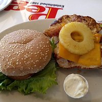The chicken sandwich comes with two checken breasts and pineapple.
