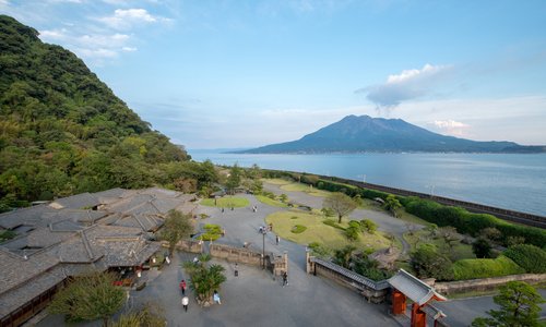 The house and gardens at Sengan-en overlooking Kinko Bay and active volcano Sakurajima
