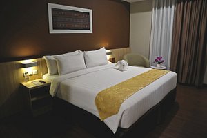 Anara Sky Kualanamu Hotel in Beringin, image may contain: Chair, Furniture, Bed, Painting