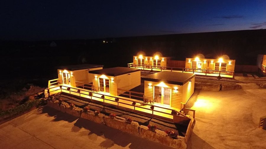 Our Sea View Chalets by night