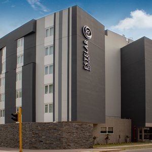 Hotel Estelar San Isidro in Lima, image may contain: Furniture, Bed, Cushion, Plate