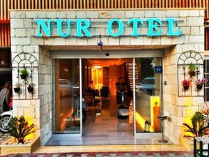 Nur Hotel in Kas, image may contain: Potted Plant, Cafe, Restaurant, Shop
